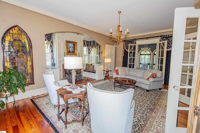 571 E Main St, Spartanburg, SC 29302 - living room with arched walkways, a chandelier, plenty of natural light, wood finished floors, and crown molding