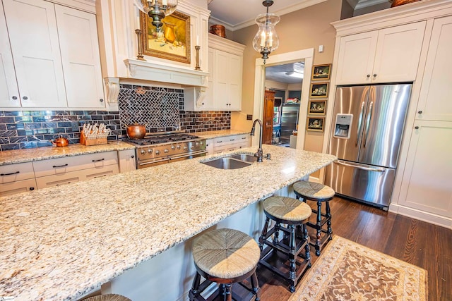 kitchen featuring stainless steel appliances, a kitchen breakfast bar, dark hardwood / wood-style floors, and crown molding