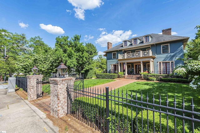 571 E Main St, Spartanburg, SC 29302 - colonial inspired home featuring a balcony, covered porch, and a chimney