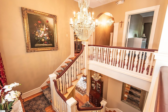 staircase with hardwood / wood-style flooring