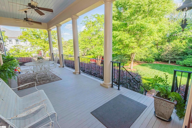 wooden terrace featuring ceiling fan