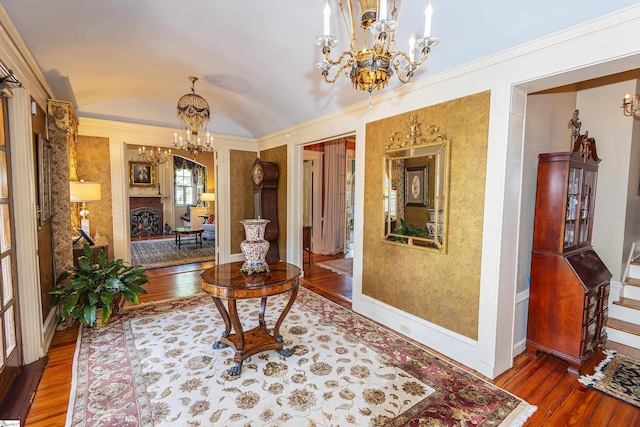 571 E Main St, Spartanburg, SC 29302 - hallway with a chandelier, wood finished floors, lofted ceiling, and baseboards