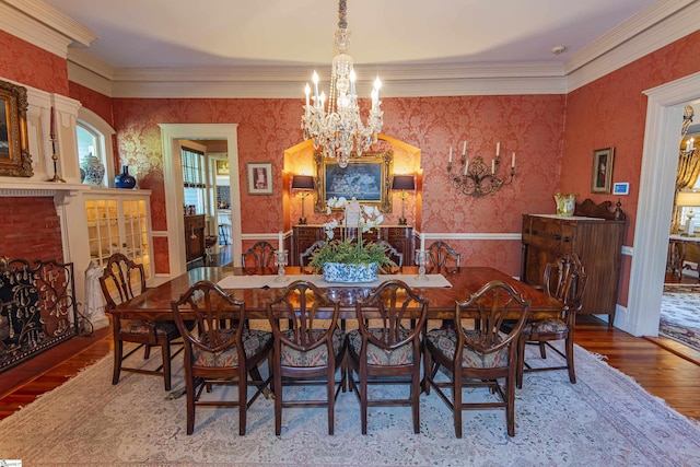 571 E Main St, Spartanburg, SC 29302 - dining room with a chandelier, wallpapered walls, wood finished floors, and crown molding
