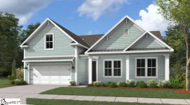 view of front of home with a garage and a front yard