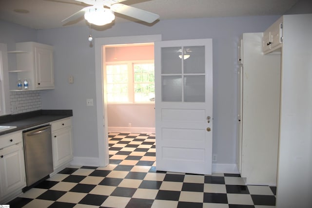 kitchen featuring stainless steel dishwasher, ceiling fan, backsplash, and white cabinetry