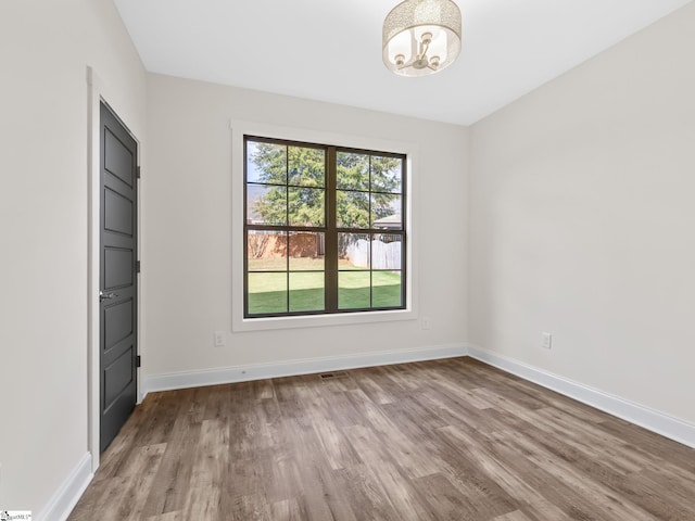 unfurnished bedroom featuring light wood-type flooring