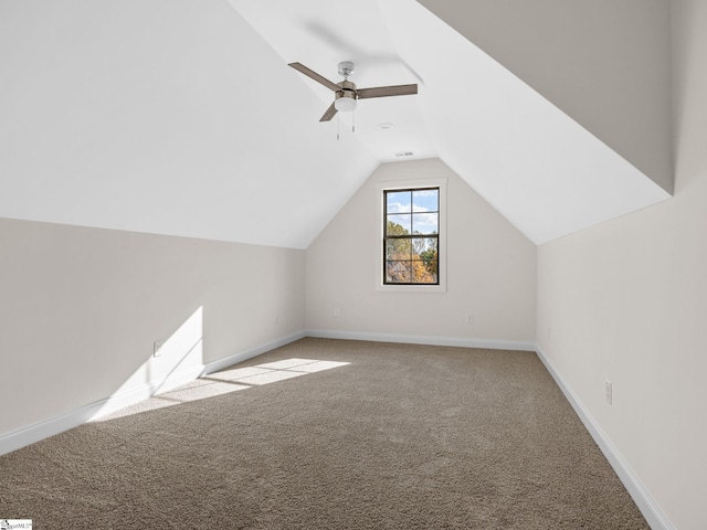 bonus room with ceiling fan, light colored carpet, and vaulted ceiling