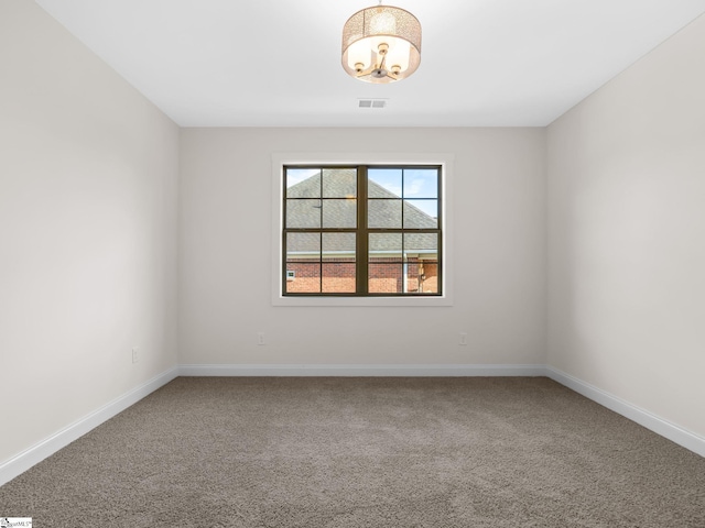 unfurnished room featuring carpet