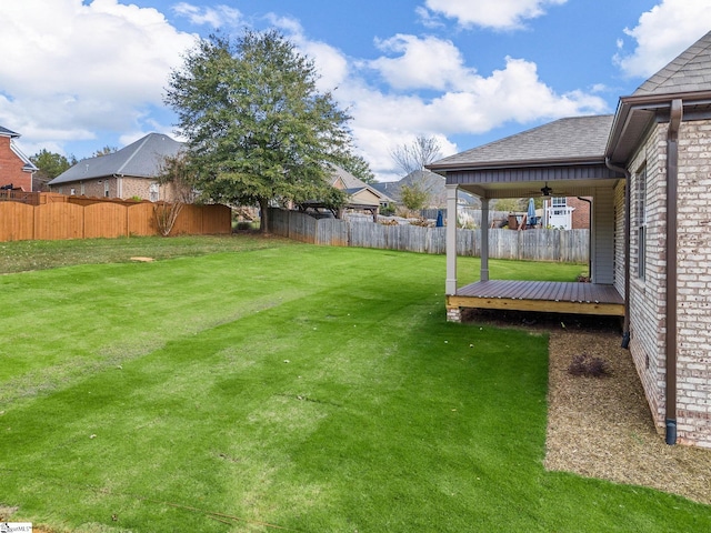 view of yard featuring a wooden deck