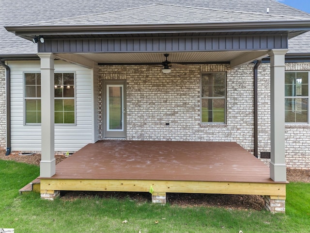 wooden deck with a lawn