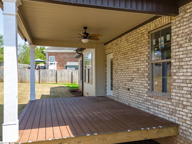 wooden terrace featuring ceiling fan