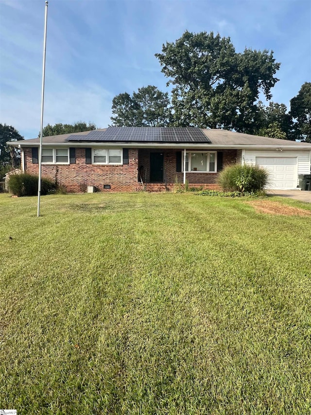 single story home with a garage and a front yard