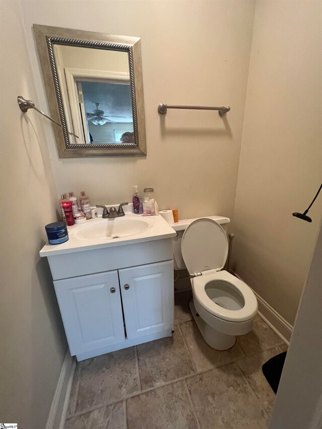 bathroom with toilet and vanity