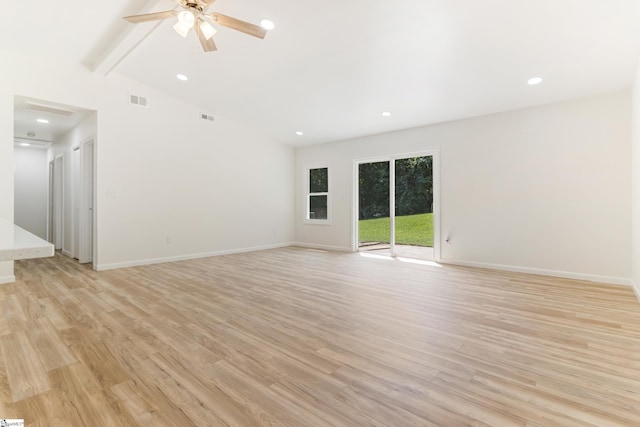 unfurnished room featuring baseboards, visible vents, and light wood-type flooring