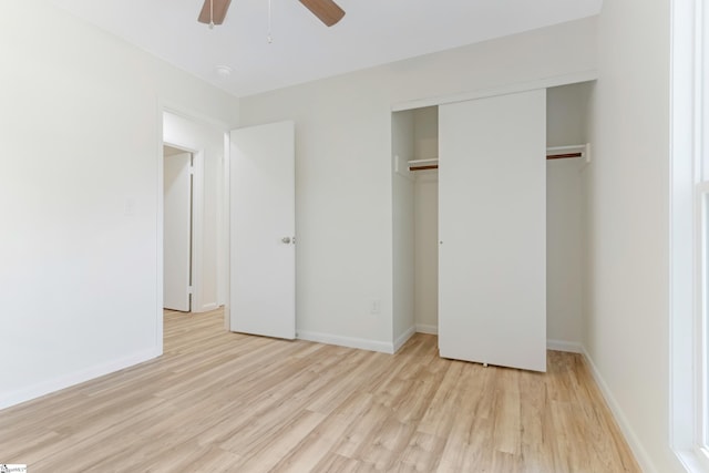 unfurnished bedroom featuring a closet, baseboards, and light wood-style floors