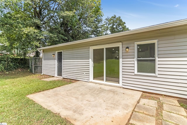 exterior space featuring a lawn and a patio area