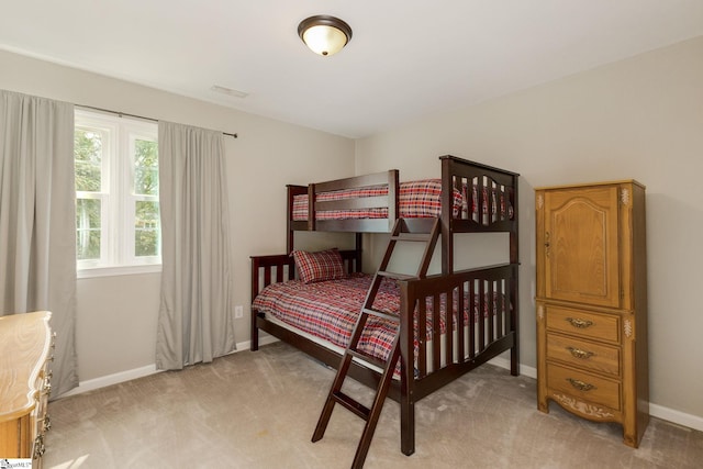 bedroom with light colored carpet