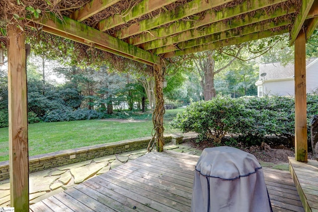 wooden terrace featuring a lawn and grilling area