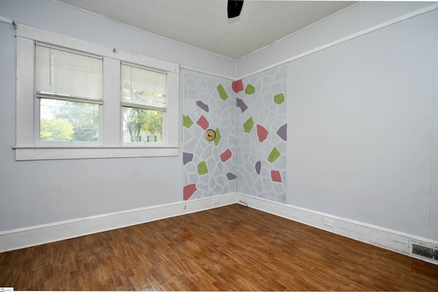 spare room featuring hardwood / wood-style floors