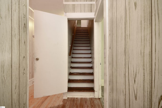 stairs with wood-type flooring