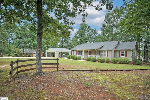 single story home featuring covered porch and a front yard