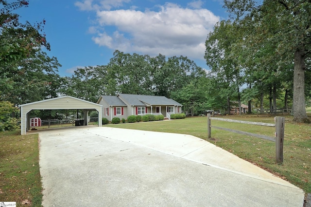 ranch-style home with a carport and a front yard