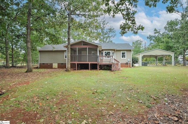 rear view of property featuring a lawn and a sunroom