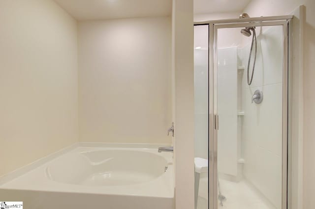 full bath with a shower stall and a bath