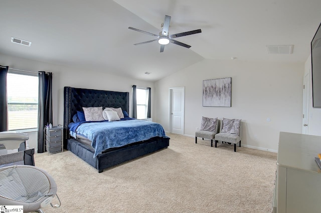 bedroom featuring ceiling fan, light colored carpet, lofted ceiling, and visible vents