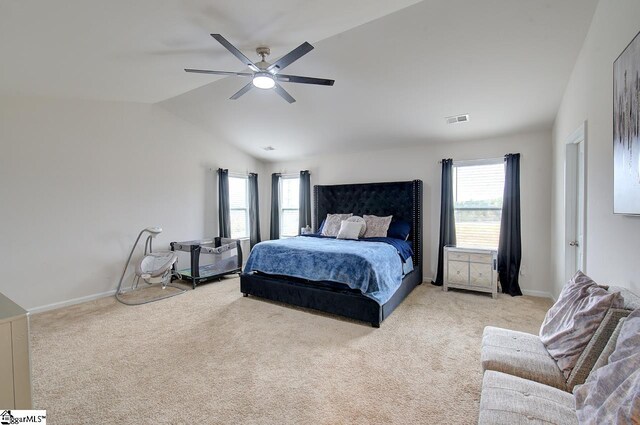 bedroom featuring light carpet, a ceiling fan, baseboards, lofted ceiling, and visible vents