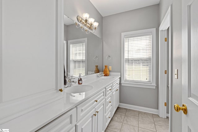 bathroom featuring tile patterned flooring and vanity