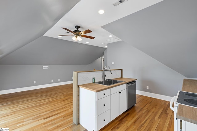 kitchen with light wood-type flooring, white cabinetry, sink, ceiling fan, and stainless steel dishwasher