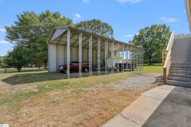 view of outdoor structure with a lawn and a carport