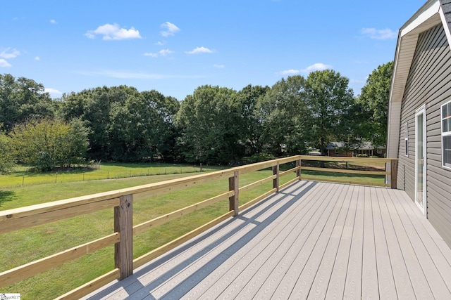 wooden deck with a yard