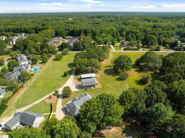 bird's eye view featuring a forest view