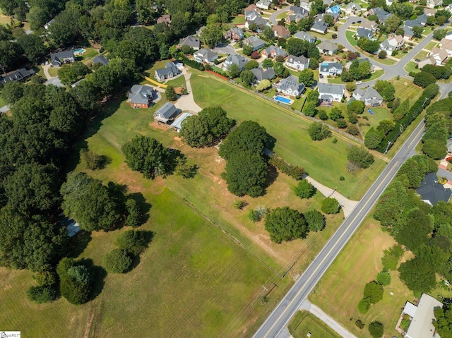birds eye view of property with a residential view