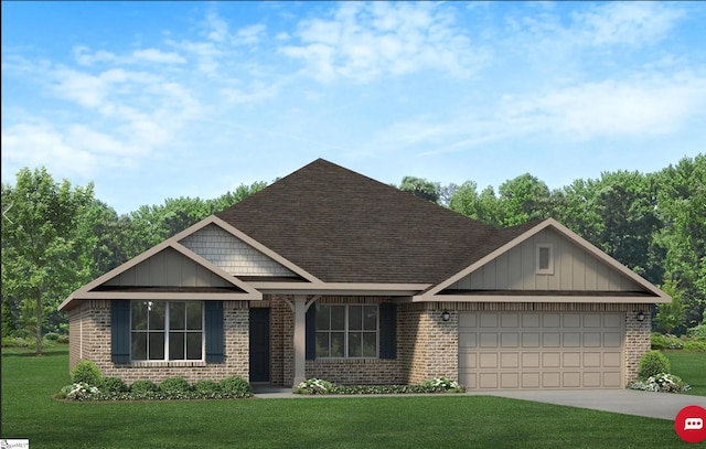 view of front of home featuring a garage and a front lawn