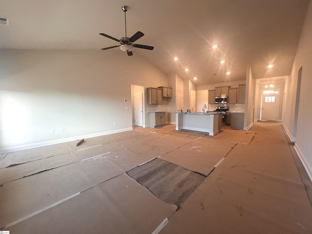 unfurnished living room featuring high vaulted ceiling and ceiling fan