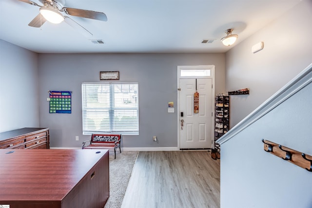 entrance foyer featuring light wood-type flooring and ceiling fan