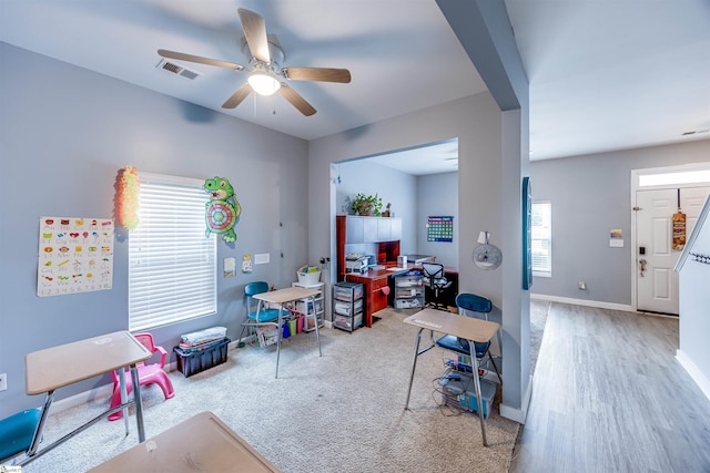 game room with ceiling fan and wood-type flooring