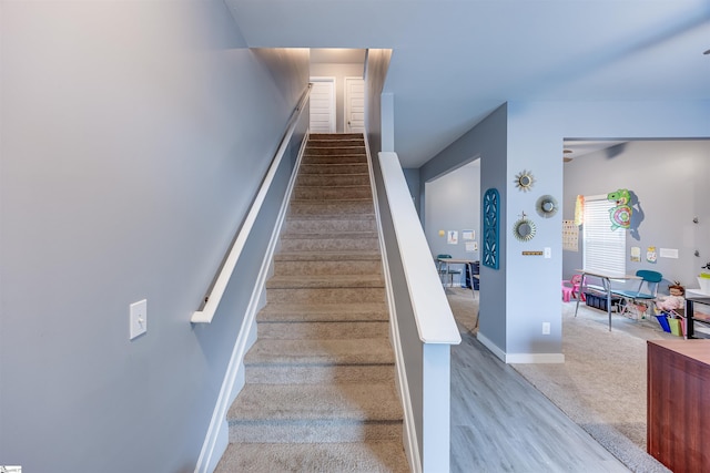 staircase featuring hardwood / wood-style flooring