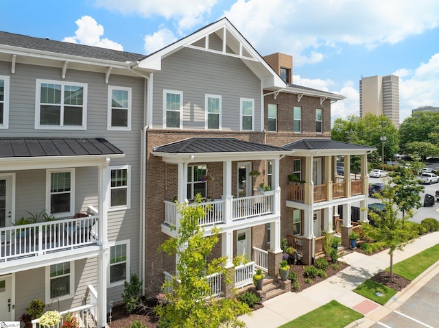 view of front of home with a balcony