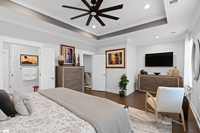 bedroom with crown molding, ceiling fan, a raised ceiling, and dark hardwood / wood-style flooring