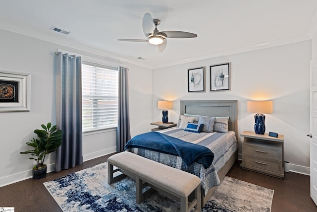 bedroom featuring ceiling fan, dark hardwood / wood-style flooring, and crown molding