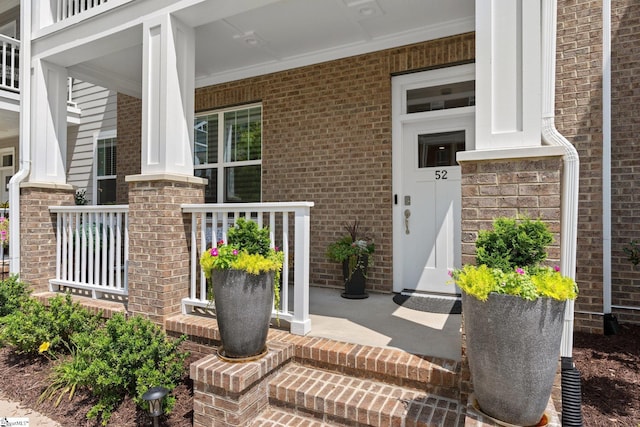 doorway to property with covered porch