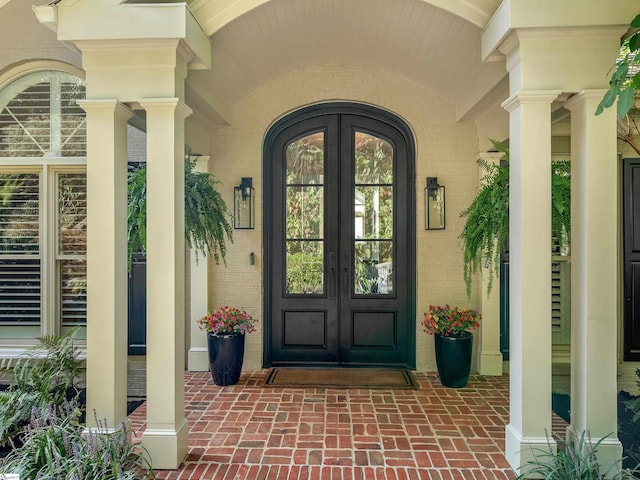 doorway to property with french doors and a porch