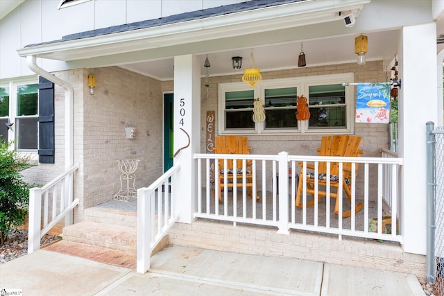 doorway to property featuring a porch