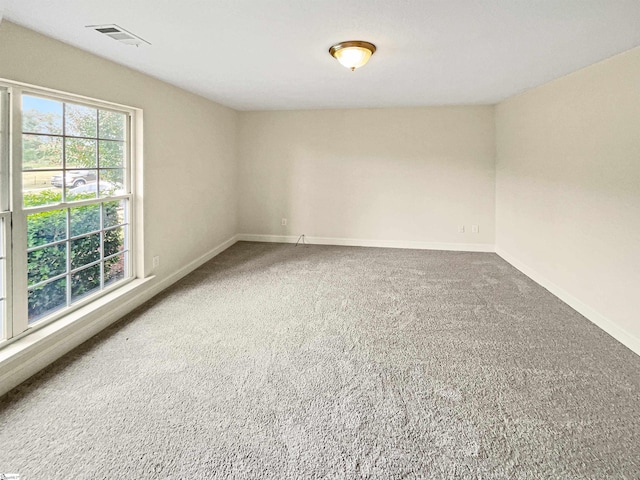 unfurnished room featuring carpet floors