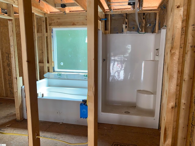 bathroom featuring a tub to relax in