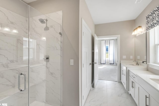 bathroom with vanity and a shower with shower door